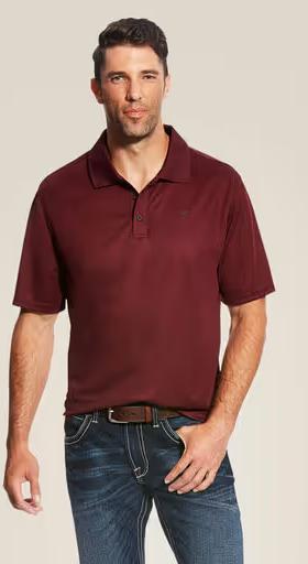 A man wearing Ariat maroon polo