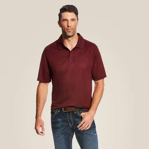 A man wearing Ariat maroon polo