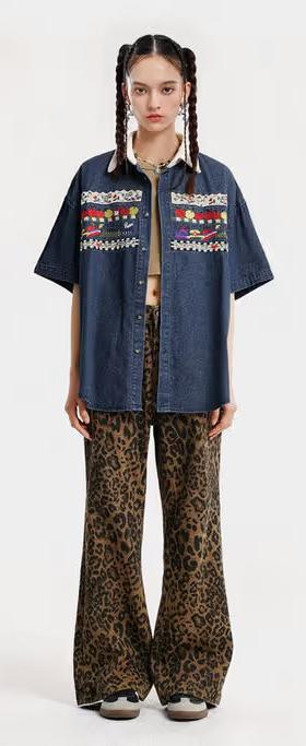 A woman wearing Aelfric Eden denim short sleeve shirt