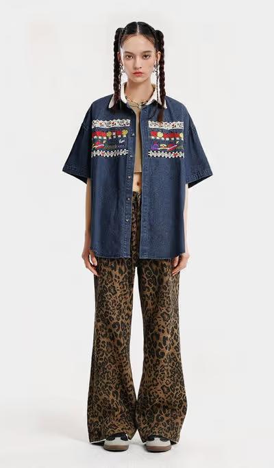 A woman wearing Aelfric Eden denim short sleeve shirt
