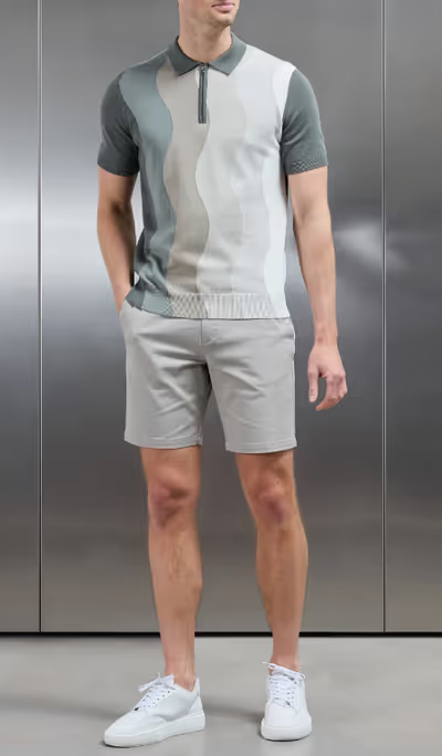 A man wearing arne wave knitted zip polo shirt - sage