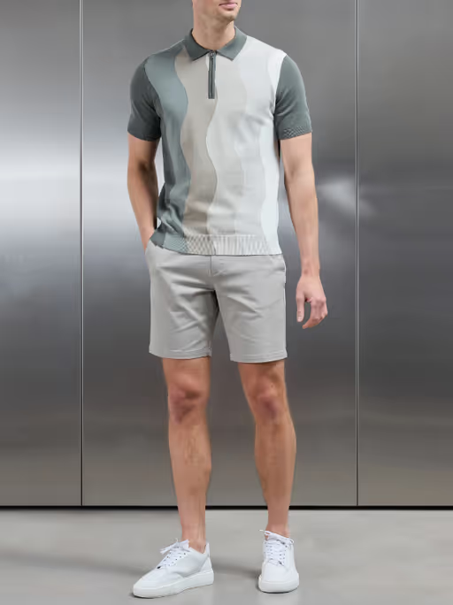 A man wearing arne wave knitted zip polo shirt - sage
