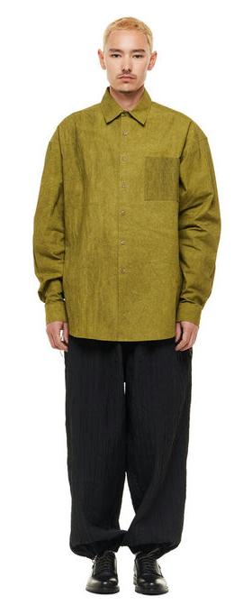 A man wearing olive green Merely Made natural dyed lazy over shirt
