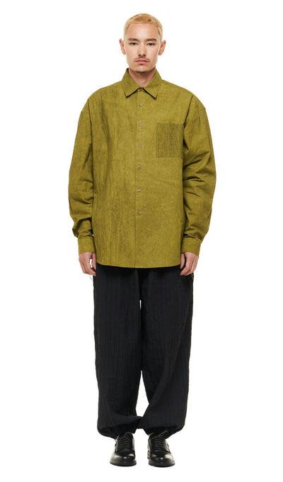 A man wearing olive green Merely Made natural dyed lazy over shirt