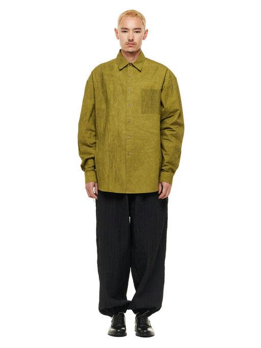 A man wearing olive green Merely Made natural dyed lazy over shirt