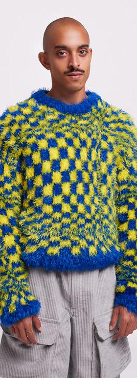 A man wearing HIBU lisbon handmade 2020vision knit jumper