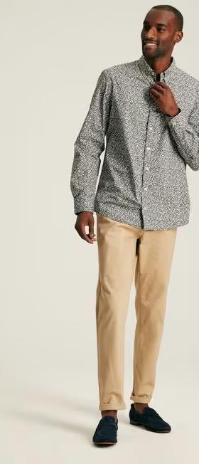 A man wearing Joules green floral cotton shirt