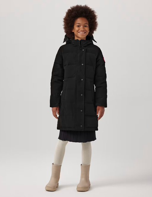 A girl wearing Canada Goose Baby youth juniper parka - black