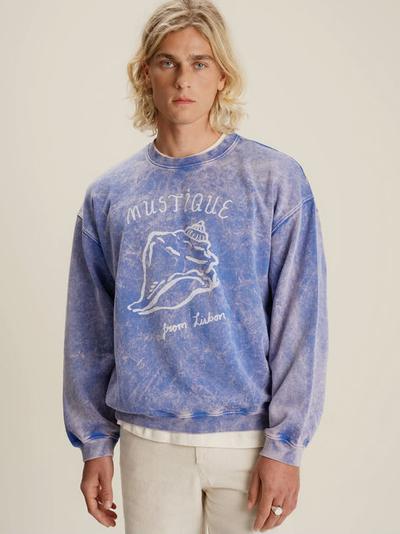 A man wearing Mustique buzio crewneck sweater