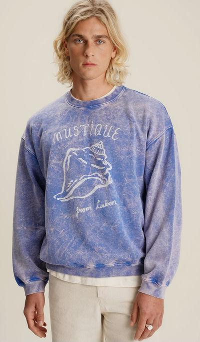 A man wearing Mustique buzio crewneck sweater