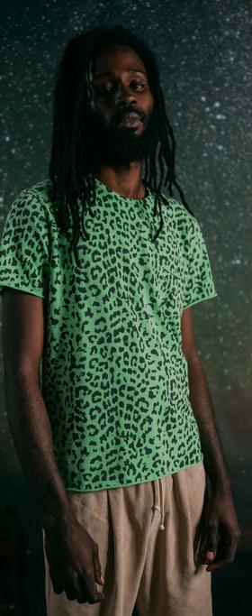 A man wearing +351 t-shirt leopard neon green