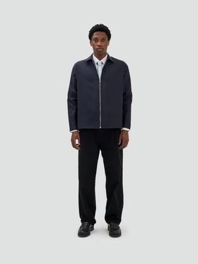 A man wearing Fairly Normal zipper overshirt black