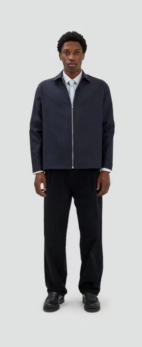 A man wearing Fairly Normal zipper overshirt black