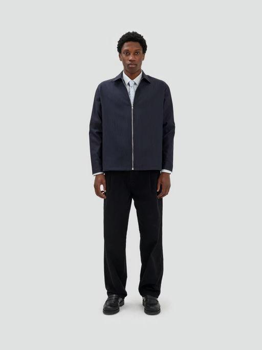 A man wearing Fairly Normal zipper overshirt black