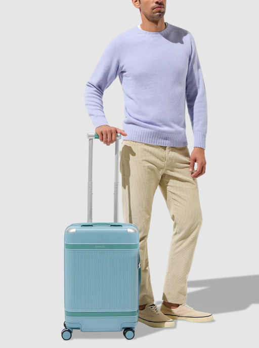 A man with PARAVEL aviator100 carry-on plus luggage