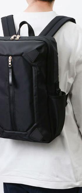 A man carrying MASTER-PIECE osaka metro × master-piece collaboration series backpack