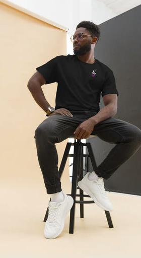 A man wearing Double B radiasi black t-shirt