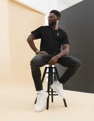 A man wearing Double B radiasi black t-shirt