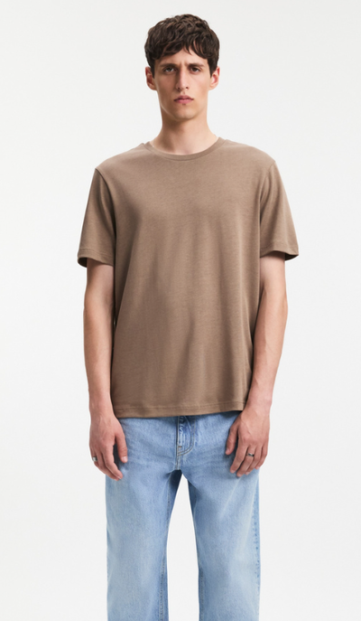 A man wearing A Day's March clay color nyx lyocell t-shirt