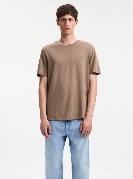 A man wearing A Day's March clay color nyx lyocell t-shirt