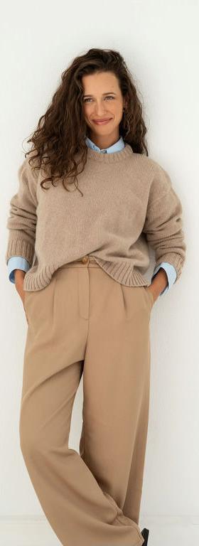 A woman wearing Naz beige claudia recycled jumper