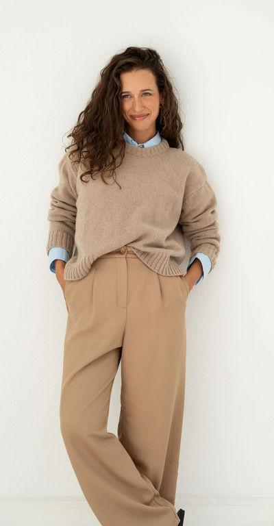 A woman wearing Naz beige claudia recycled jumper