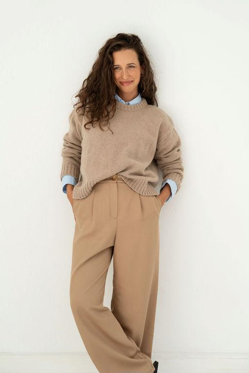 A woman wearing Naz beige claudia recycled jumper