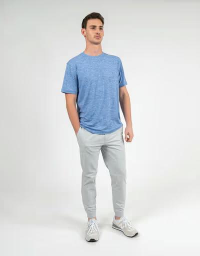 A man wearing Rhoback short sleeve tailwind performance tee