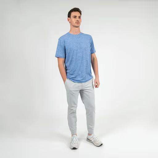 A man wearing Rhoback short sleeve tailwind performance tee