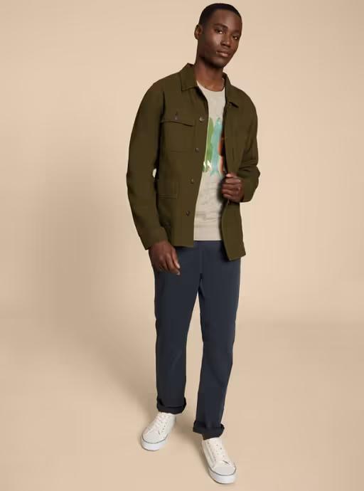 A man wearing White Stuff khaki green kynman workwear jacket