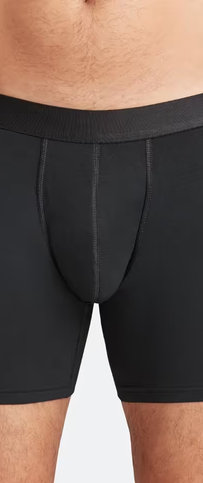 A man wearing a black pair of MeUndies boxers