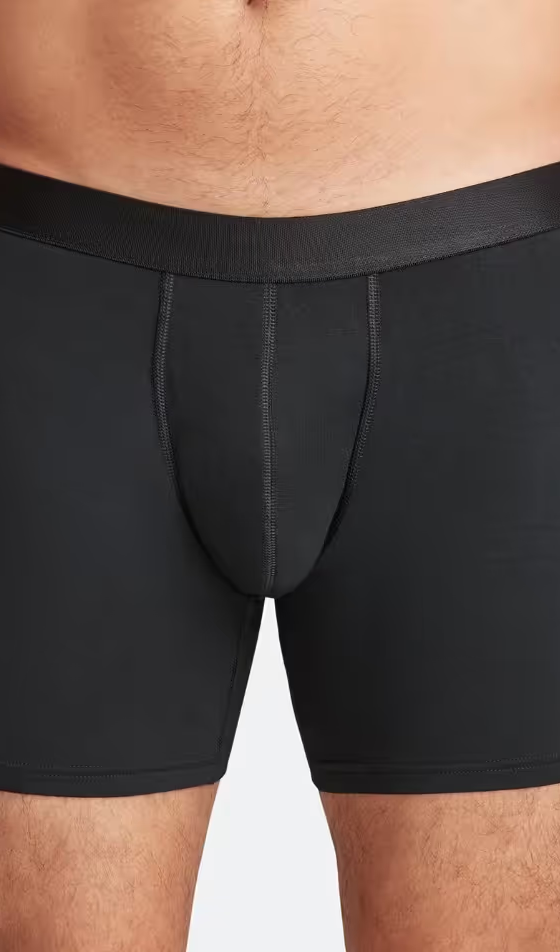 A man wearing a black pair of MeUndies boxers
