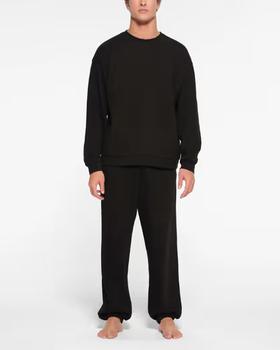 A man wearing Skims classic crewneck t-shirt