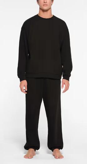 A man wearing Skims classic crewneck t-shirt