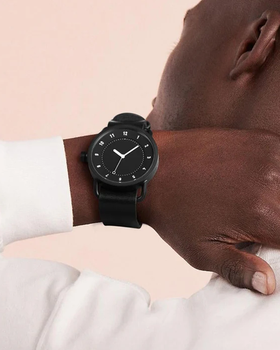 A man wearing black dial watch from TID Watches