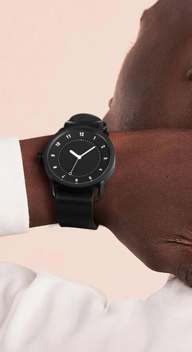 A man wearing black dial watch from TID Watches