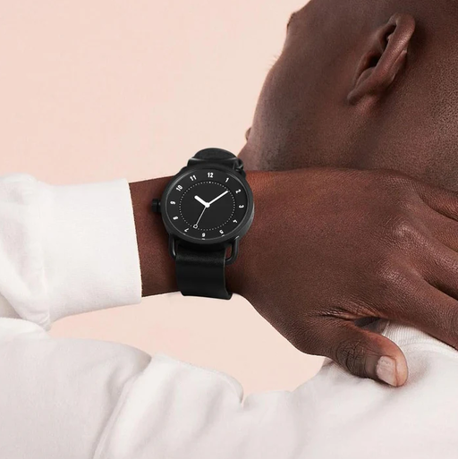 A man wearing black dial watch from TID Watches