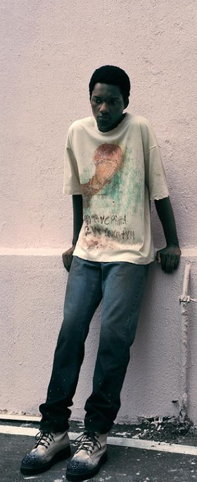 A man wearing Piet Sau Paulo printed t-shirt
