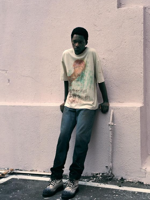 A man wearing Piet Sau Paulo printed t-shirt