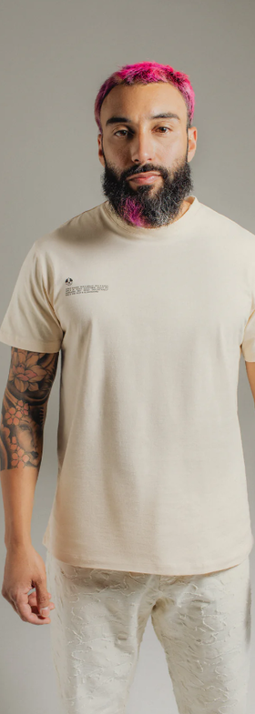 A man wearing Hirundo almond t-shirt