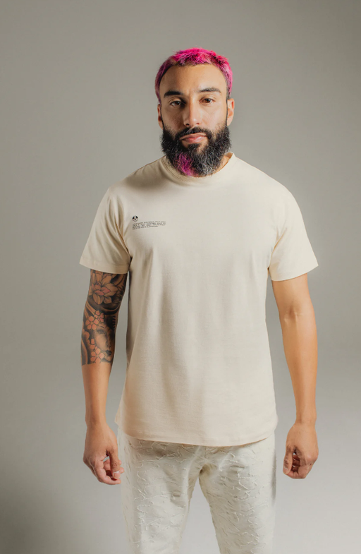 A man wearing Hirundo almond t-shirt
