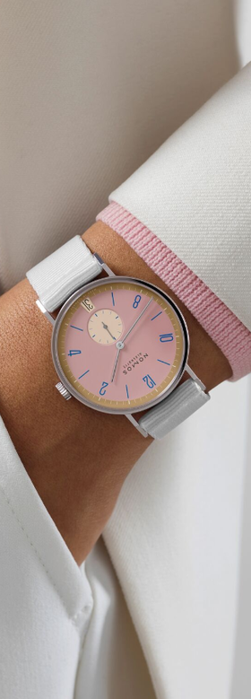 A man wearing NOMOS watch