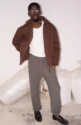 A man wearing Cotton Project sau paulo maroon puff jacket
