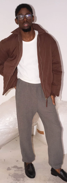 A man wearing Cotton Project sau paulo maroon puff jacket