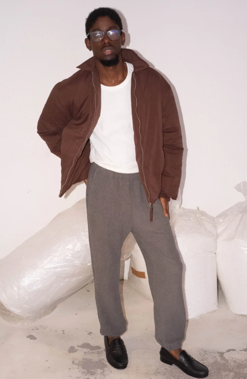 A man wearing Cotton Project sau paulo maroon puff jacket