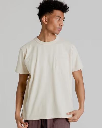 A man wearing Velva Sheen pigment dye shirt