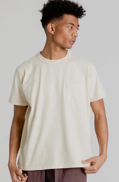 A man wearing Velva Sheen pigment dye shirt