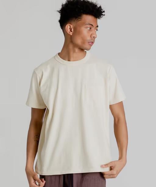 A man wearing Velva Sheen pigment dye shirt