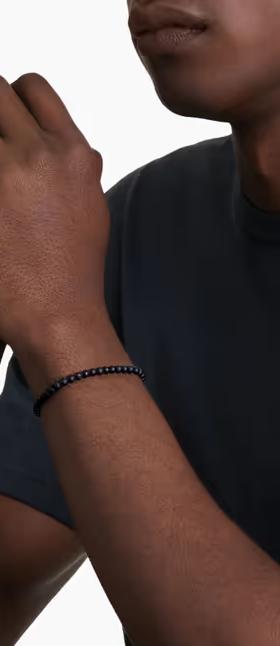 A man wearing David Yurman spiritual beads bracelet