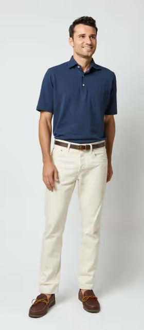 A man wearing Sid Mashburn navy short-sleeved polo